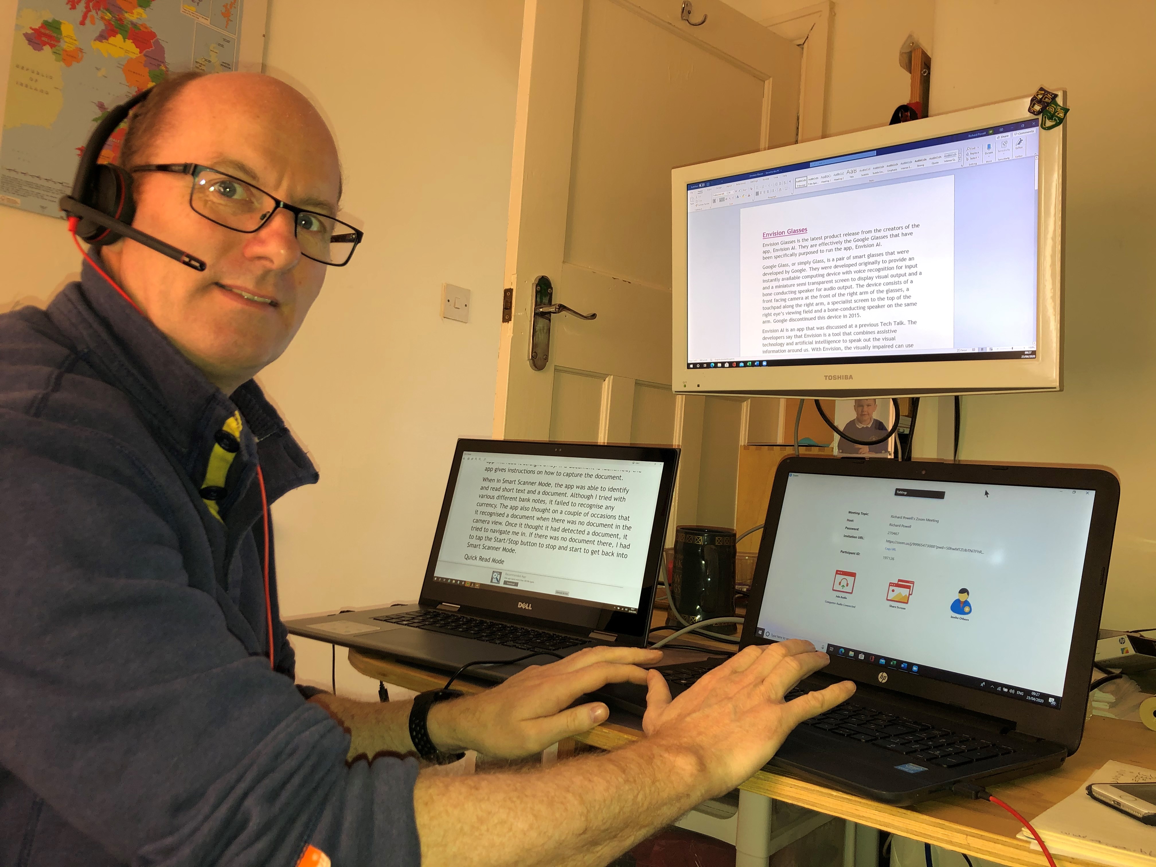 A picture of richard powell at his desk smiling